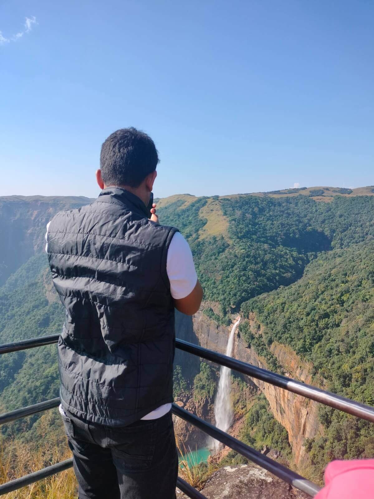 Nohkalikai Falls plunging into a green pool, Cherrapunji